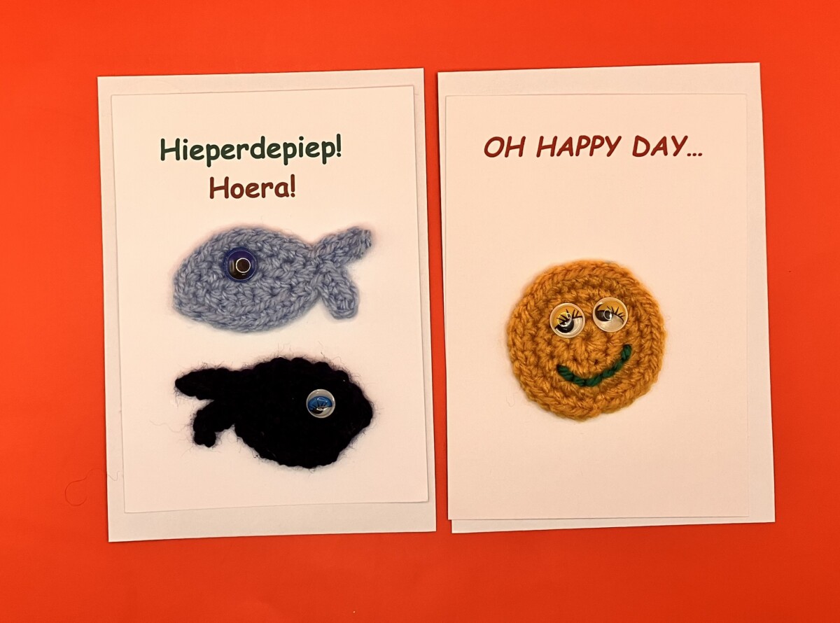Uitgelichte afbeelding voor “Ansichtkaarten vis en smiley”